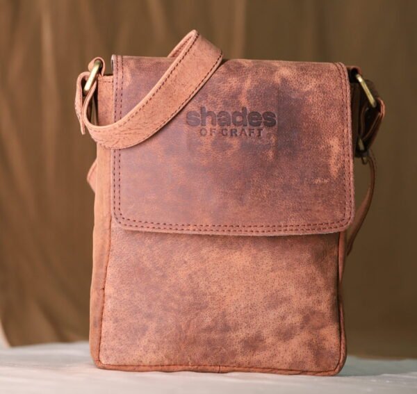 dark brown leather sling bag